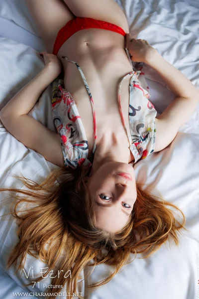 Vi Ezra sexy girl on the bed with pretty smile Photo Cover